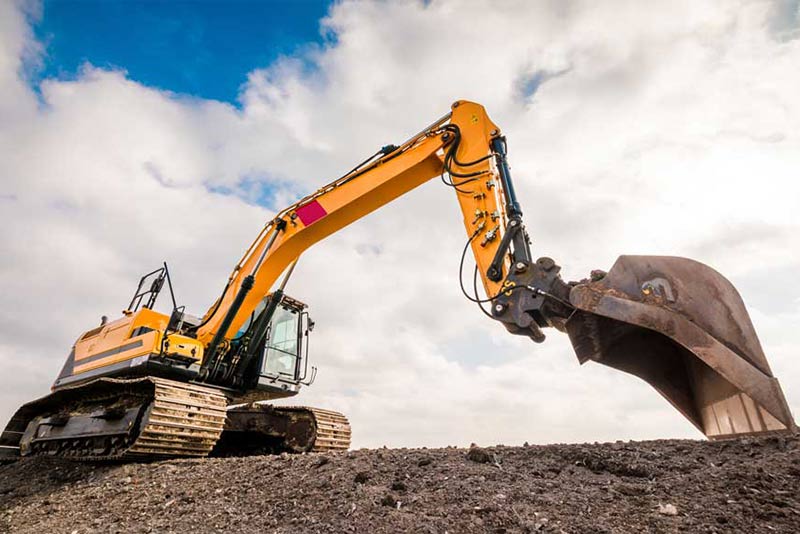Earthmoving being completed with excavator and bucket